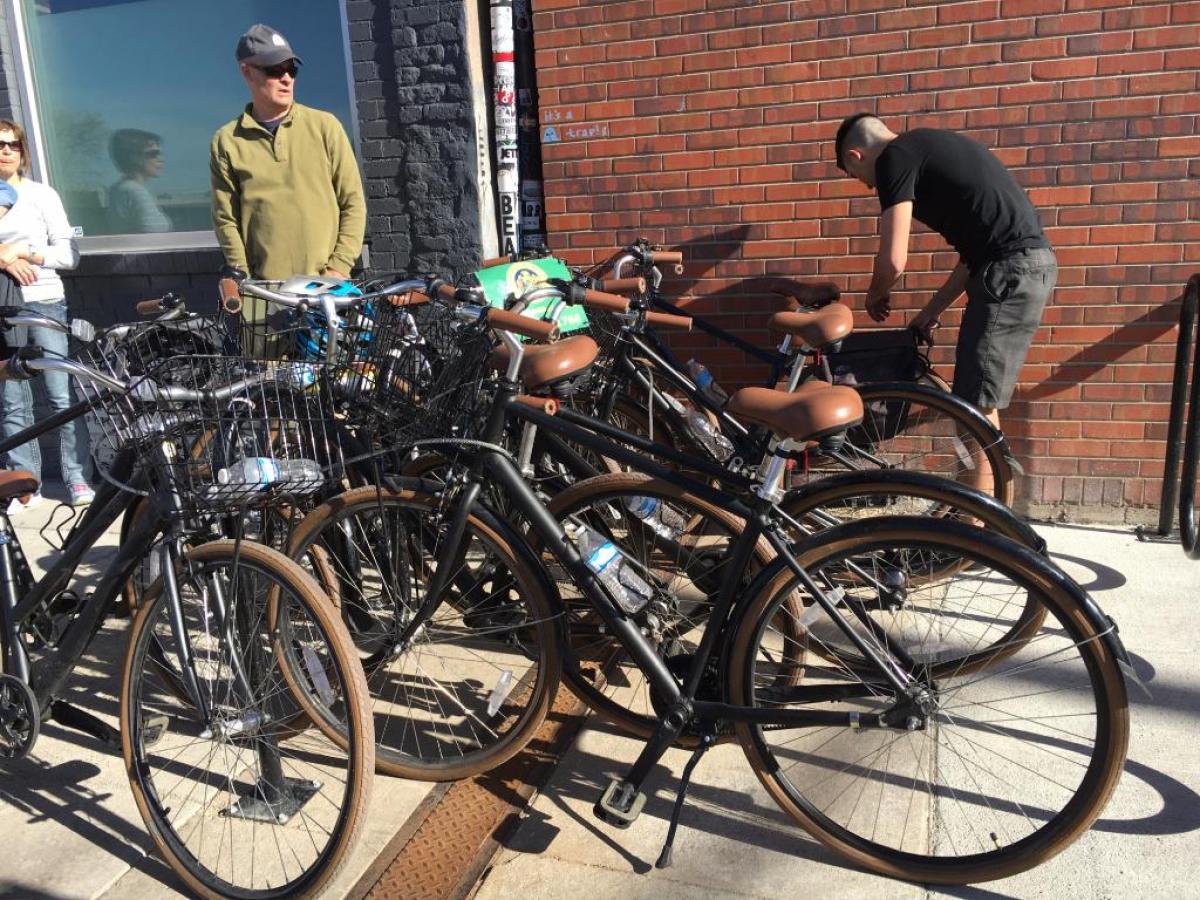a bicycle parked in front of a brick building