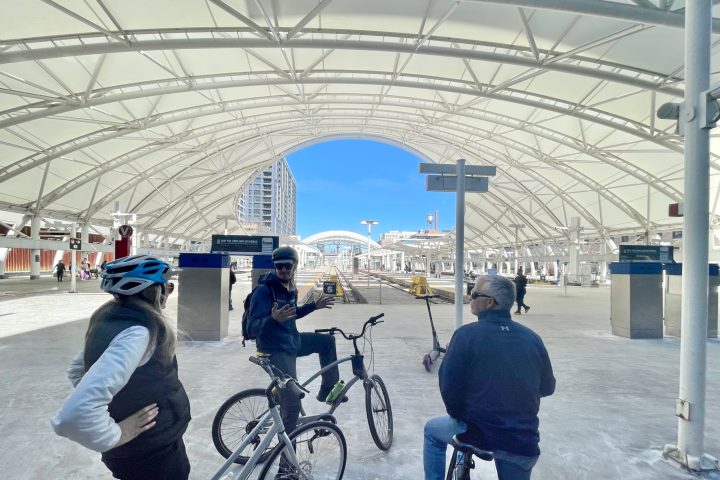 a person riding on the back of a bicycle