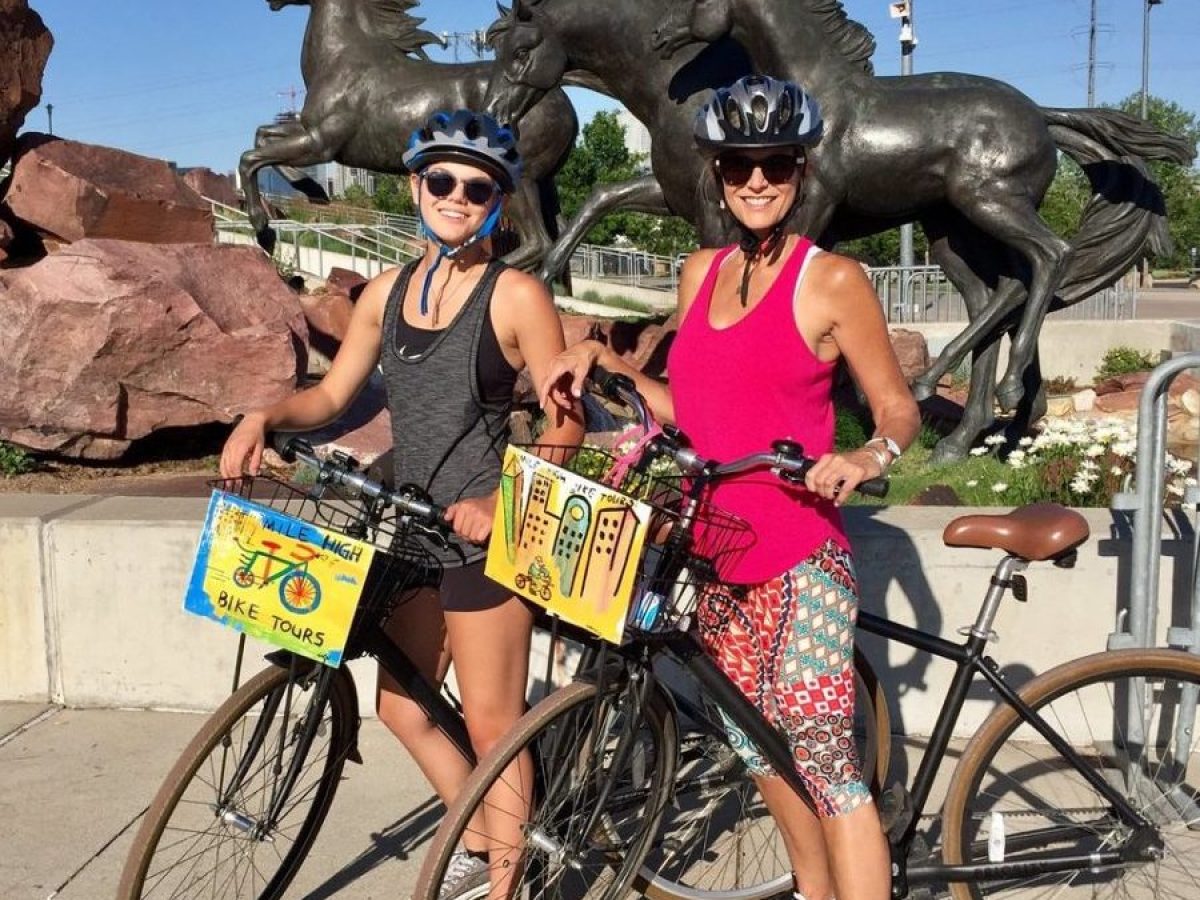 a person riding on the back of a bicycle